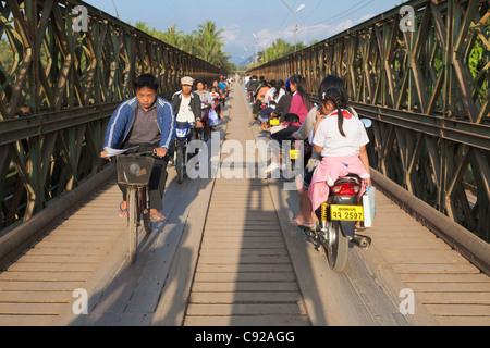 Cycling over the Nam Khan River, Luang Prabang, Laos