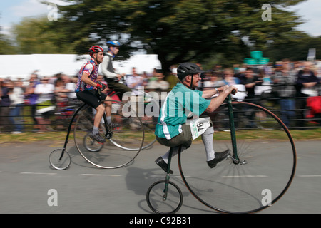 Knutsford Great Race held once every ten years. Penny Farthing Cycles race for three hours around Knutsford, Cheshire, England Stock Photo