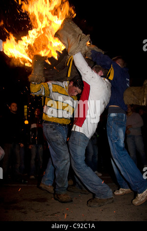 The quirky annual Carrying the Flaming Tar Barrels, held on Bonfire night in the small town of Ottery St Mary, in Devon, England Stock Photo