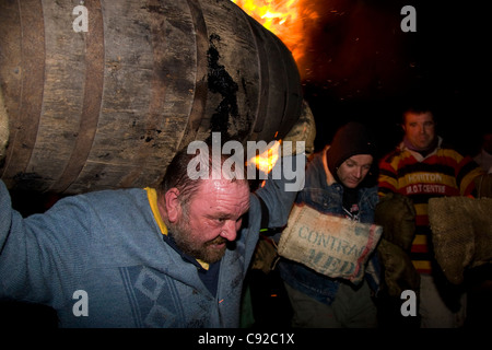 The quirky annual Carrying the Flaming Tar Barrels, held on Bonfire night in the small town of Ottery St Mary, in Devon, England Stock Photo