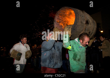 The quirky annual Carrying the Flaming Tar Barrels, held on Bonfire night in the small town of Ottery St Mary, in Devon, England Stock Photo