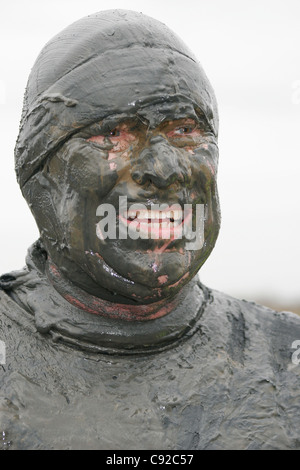 The quirky annual 'Mad' Maldon Mud Race, held one day around New Year depending on the tides, in Maldon, Essex, England Stock Photo