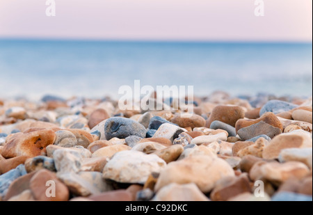 Close up of pebbles on rocky beach Stock Photo