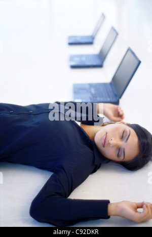 Businesswoman sleeping in an office Stock Photo - Alamy