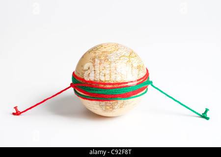 Earth globe wrapped with rope Stock Photo - Alamy