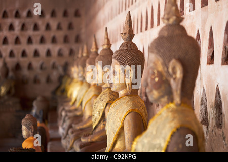 Ancient Buddha images line the courtyard walkway at Wat Si Saket in Vientiane, Laos. Stock Photo