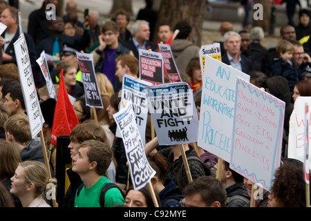 students protest in central London UK, about cuts to public spending and increase in tuition fees Stock Photo