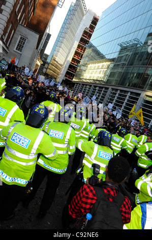 London, UK 9th Nov, 2011. Students march from University College of London to Moorgate to London Wall in their protest against rises in tuition fees almost a year after their first protest which led to violent clashes with police and a break in at the Conservative Party Building on Millbank. Stock Photo