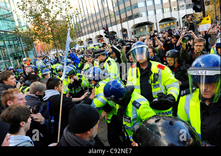 London, UK 9th Nov, 2011. Students march from University College of London to Moorgate to London Wall in their protest against rises in tuition fees almost a year after their first protest which led to violent clashes with police and a break in at the Conservative Party Building on Millbank. Stock Photo