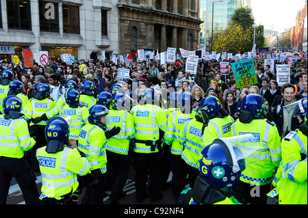 London, UK 9th Nov, 2011. Students march from University College of London to Moorgate to London Wall in their protest against rises in tuition fees almost a year after their first protest which led to violent clashes with police and a break in at the Conservative Party Building on Millbank. Stock Photo