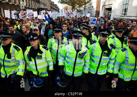 Police lead student march through central London to protest against rises in tuition fees and changes to higher education. The police were out in force as thousands of students marched through central London. Some 4,000 officers were on duty, as demonstrators marched peacefully in a protest against  Stock Photo