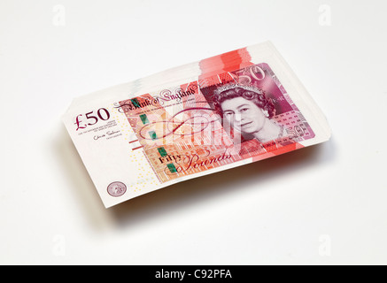 50 pound British currency bank notes £50 cash rich pile wealthy Stock Photo