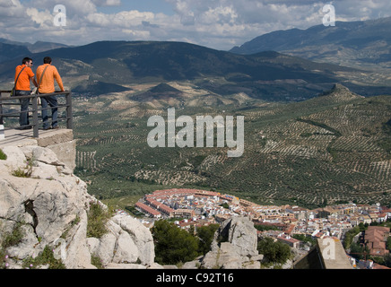 Tourists looking at view of city and surrounding countryside, from Parador de Jaen Castillo de Santa Catalina, Jaen, Jaén Province,  Andalusia, Spain Stock Photo