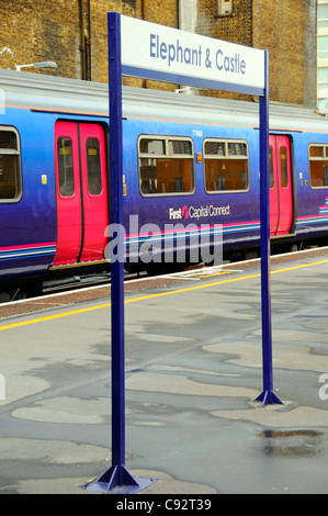 Elephant and Castle train station platform and First Capital Connect passenger train framed by railway station sign South London England UK Stock Photo