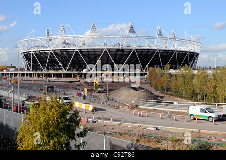 Landscaping work in progress around completed modern 2012 Olympic stadium structure building Olympic Park Stratford City Newham East London England UK Stock Photo