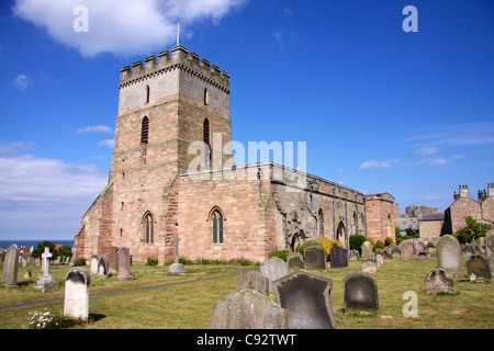 The churchyard of St. Aidan's Church in Bamburgh contains the grave and memorial which commemorates Grace Darling a heroine Stock Photo