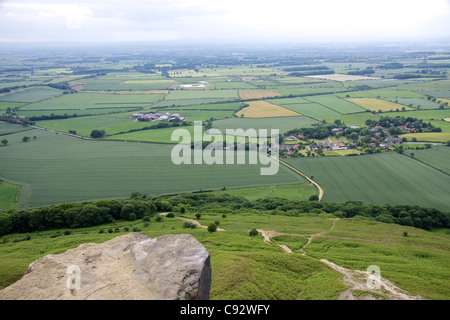 Roseberry Topping is a distinctive hill one of the highest hills in the North York Moors surrounded by farmland. Stock Photo
