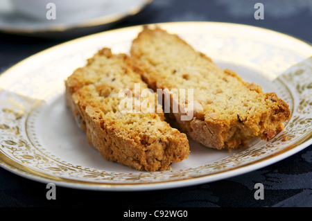 Home made vegan almond biscotti on a plate. Biscotti is a a twice-baked cake originating in the Italian city of Prato. Stock Photo