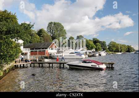 Tourist family boat landing jetties boathouses on Windermere at Waterhead, Ambleside in the English Lake District National Park Stock Photo