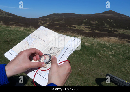 A map and compass in the Lake District Stock Photo