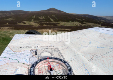 A map and compass in the Lake District Stock Photo