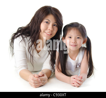 Asian mother and her daughter on white background Stock Photo