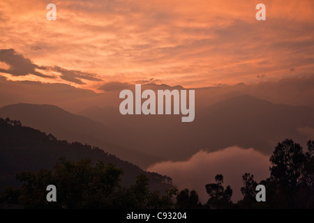 Sunset over the mountains surrounding the hilltop town of Mongar. Stock Photo