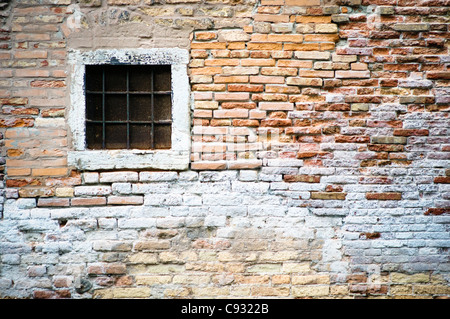 Old brickwall with window in Venice Stock Photo