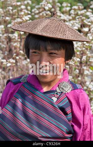 A smartly dressed women in national costume at her hillside farm in the Mangde Chhu Valley. Stock Photo