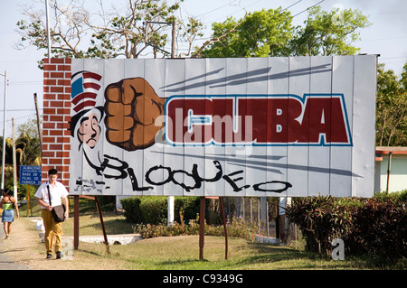 Sign against the US blockade on the road between Cienfuegos and Trinidad, Cuba Stock Photo