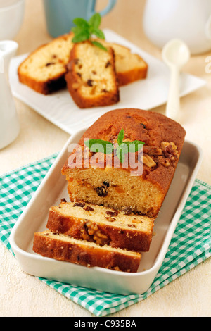 Plum cake with nuts and raisins. Recipe available. Stock Photo