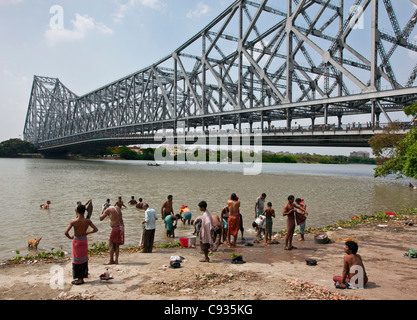 Devout Hindus bathe in the Hooghly River, a tributary of the Ganges the most venerated river on earth. Stock Photo