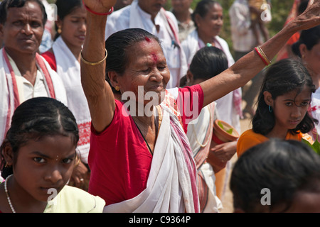 A Hindu woman praises God during a religious procession to celebrate the opening of a new Shiva Temple at Raha, Nagoan. Stock Photo