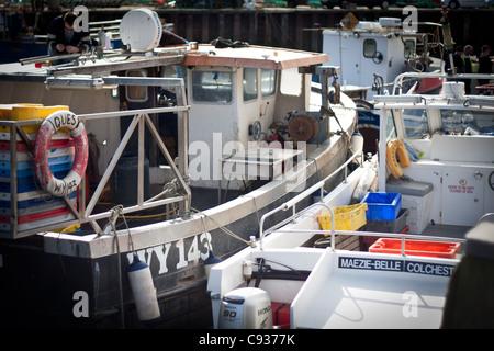 Whitby by the sea, with the boats at the docks and dockyard showing the beautiful scenic views with the boats in the distance. Stock Photo