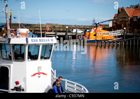 Whitby by the sea, with the boats at the docks and dockyard showing the beautiful views with the sea in the distance. Stock Photo