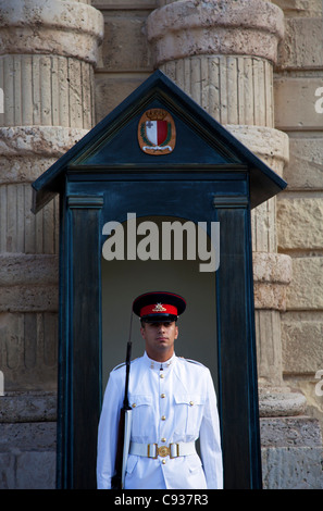Malta, Europe; A guard in Summer military uniform outside the Presidential Palace in Valletta Stock Photo