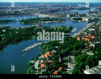 View of lush green islands around sailboats, shorelines and bridges of Stockholm in summer from the air Stock Photo