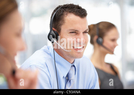Young businessman wearing headset Stock Photo