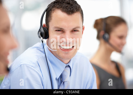 Young businessman wearing headset Stock Photo