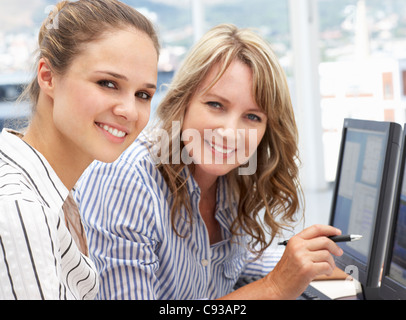 Businesswomen working on computers Stock Photo