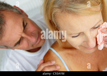 Man comforting crying wife Stock Photo