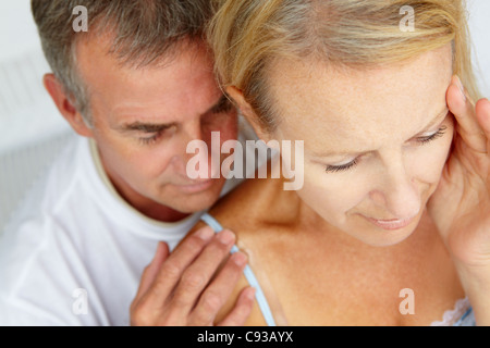 Man comforting distressed wife Stock Photo