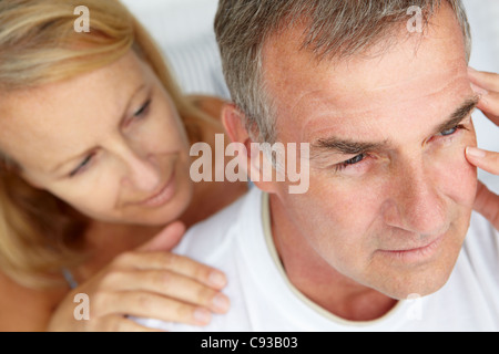 Woman comforting anxious husband Stock Photo