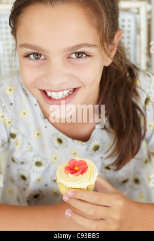 Young girl with cupcake Stock Photo