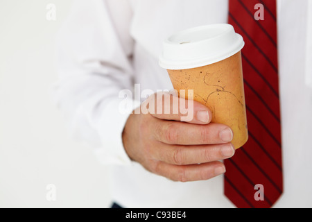 Businessman holding takeout coffee Stock Photo