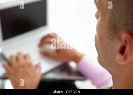 Young businessman using laptop Stock Photo