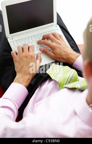 Young businessman using laptop Stock Photo
