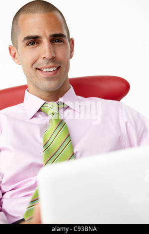 Young businessman using laptop Stock Photo