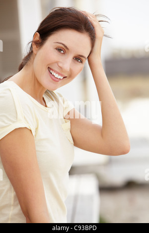 Portrait woman sitting outdoors Stock Photo