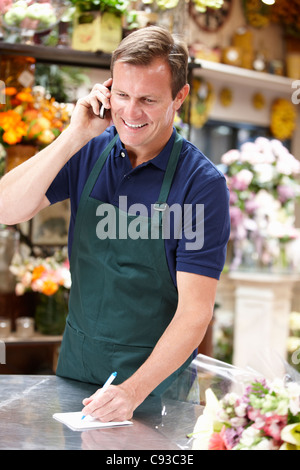 Man working in florist Stock Photo